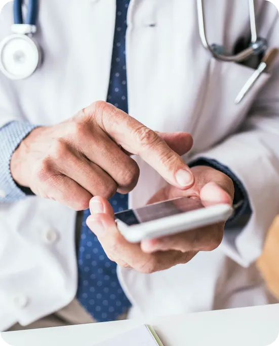Doctors checking appointments on a smartphone with Doctena